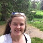 Female taking a selfie in the woods